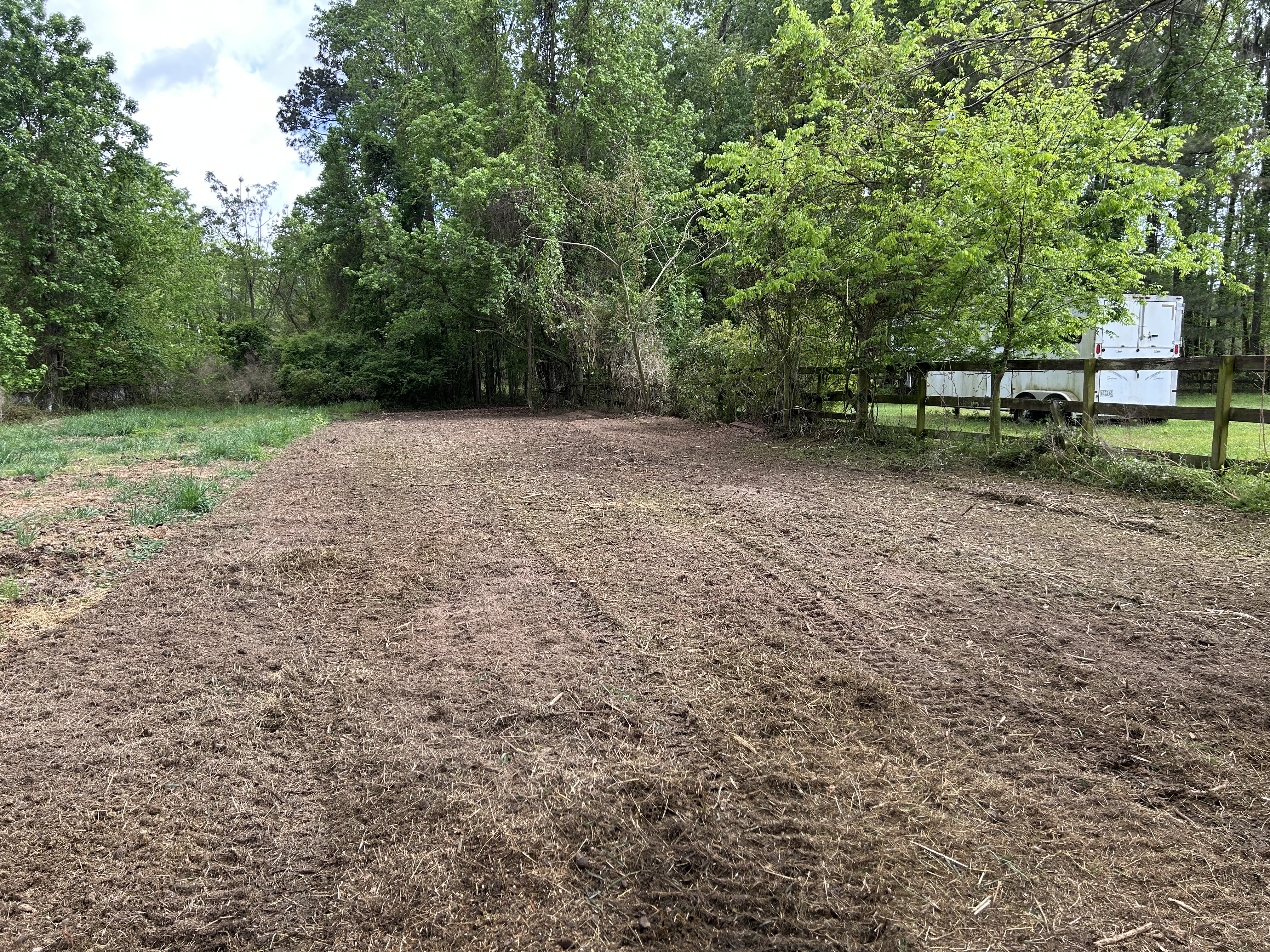 Freshly cleared residential lot with mulch ground cover